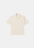 vue de face sur fond blance d ela Chemise Homme Lacoste en Seersucker Beige Coupe Boxy