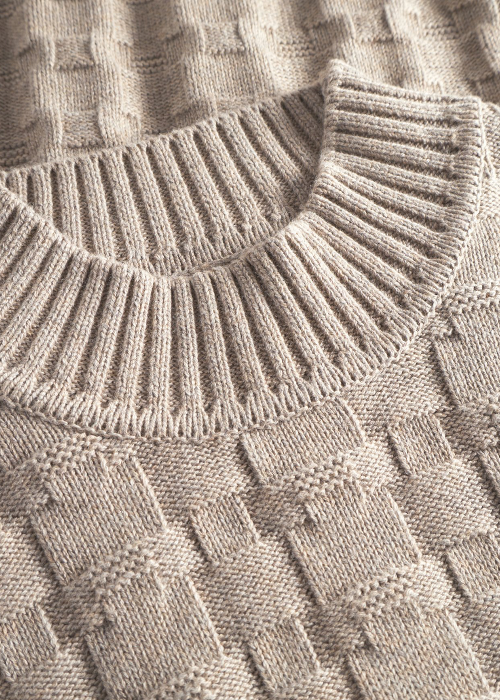 détai coll maille tressée pull norse