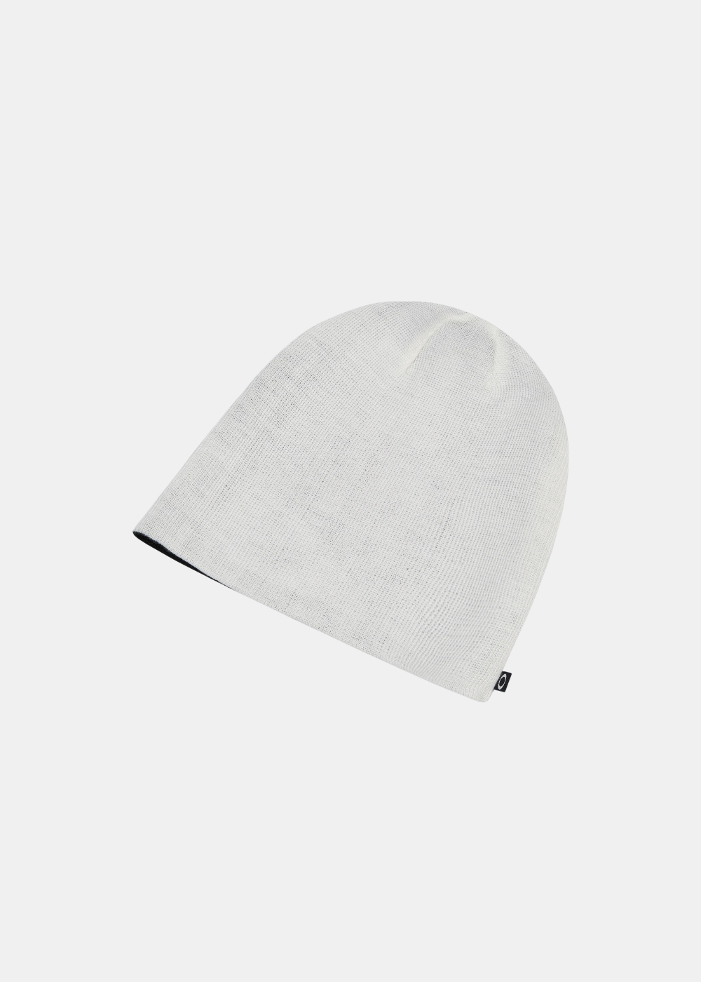 Vue du côté réversible blanc du bonnet homme Oakley Mainline avec étiquette tissée logo Ellipse