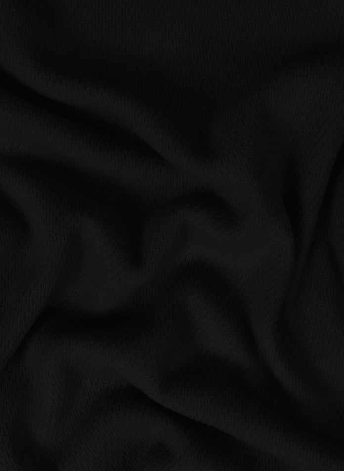 detail de la matiere en mesh du pull stone island waffle matiere noir