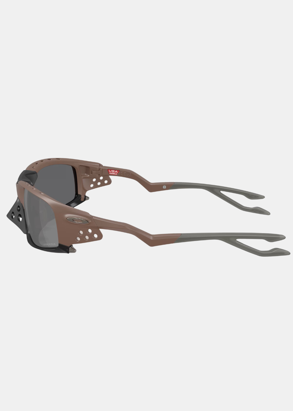 Lunettes Oakley Plantaris SQ marron de profil montrant la forme courbée des branches et le logo Oakley métallique.