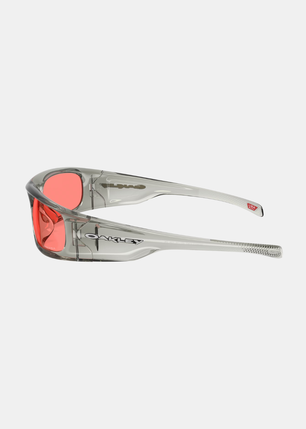 Vue de profil des lunettes Oakley Highland montrant la transparence de la monture et le marquage USA Made.