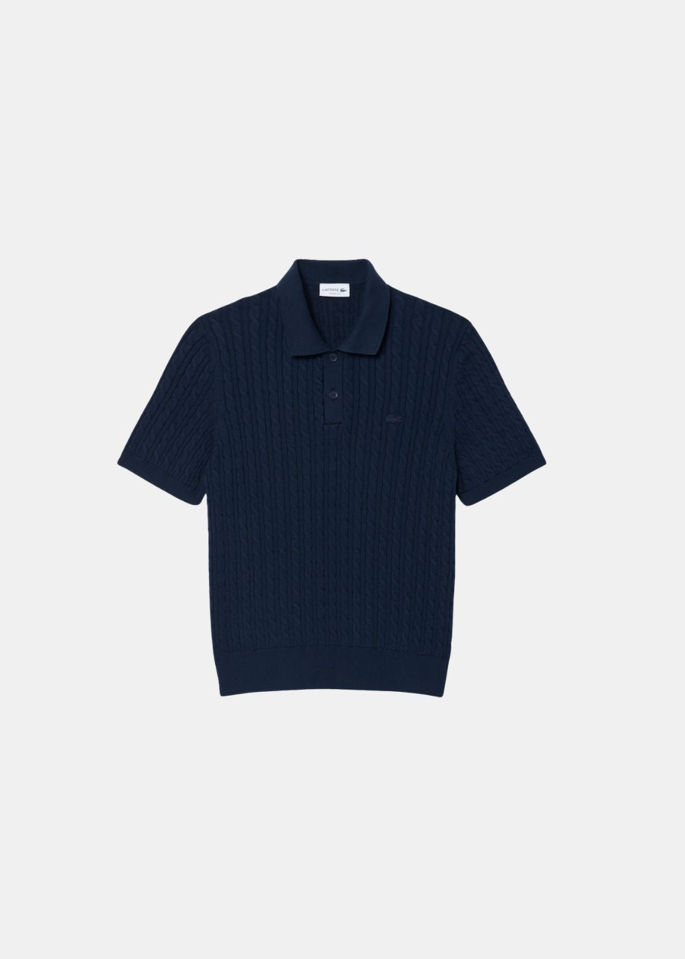 Packshot de face du polo Lacoste en maille torsadée bleu marine avec col polo à boutons.