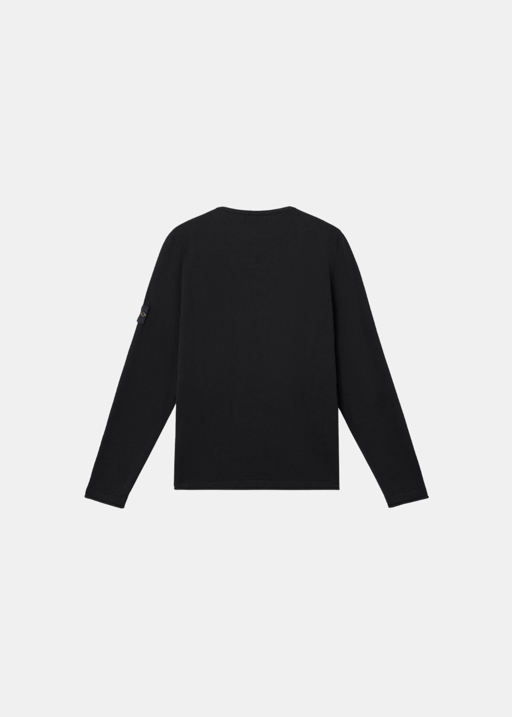 Vue de dos du pull Stone Island noir, illustrant la structure de la maille technique.