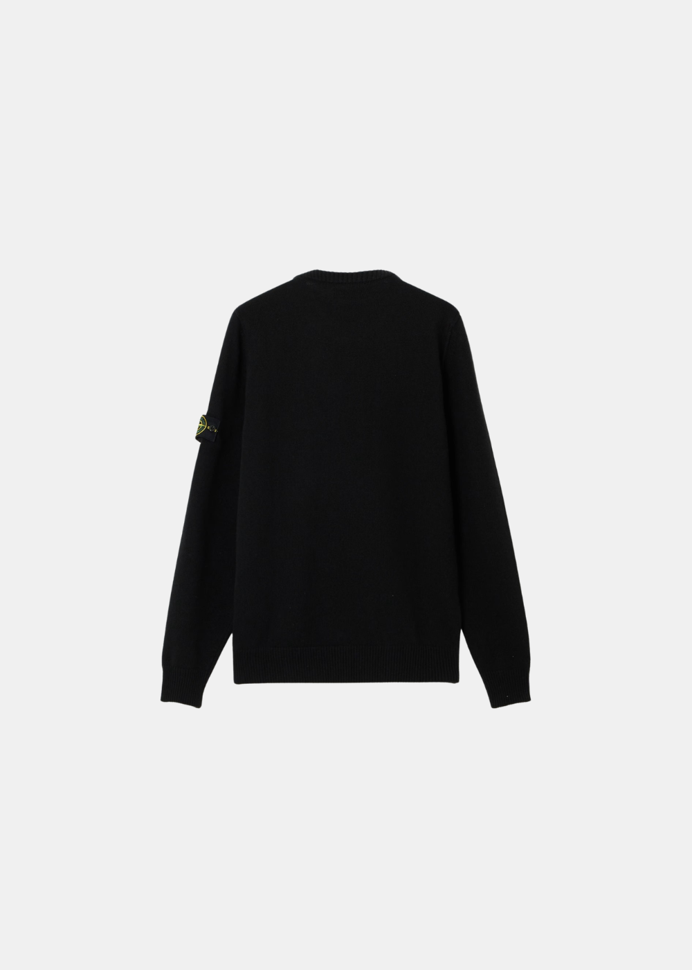 Packshot de dos d'un pull noir à manches longues Stone Island montrant la coupe droite et les finitions côtelées.