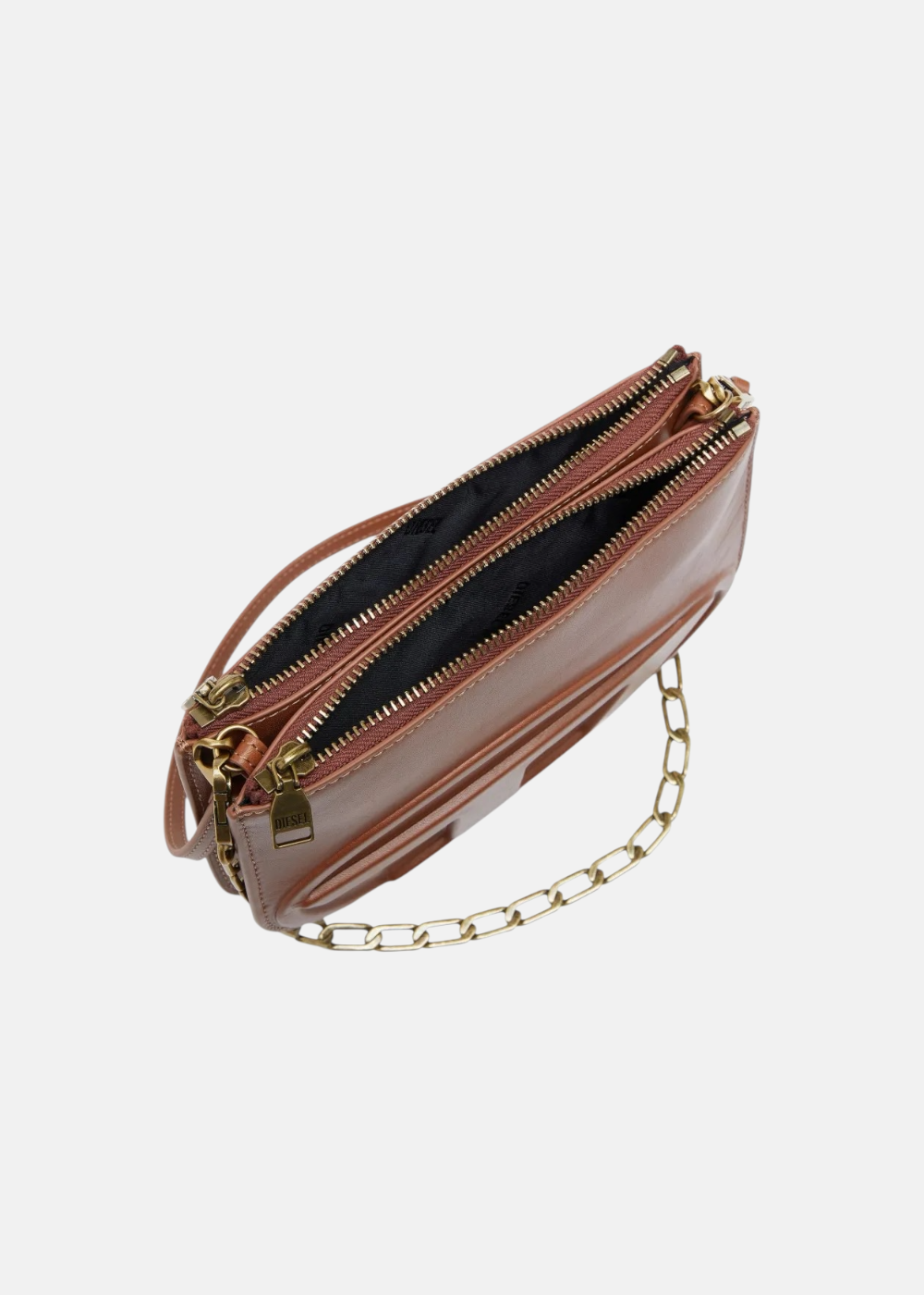 Vue de l'intérieur du sac Diesel 1DR Twin en cuir marron illustrant les deux compartiments de rangement distincts et la doublure.