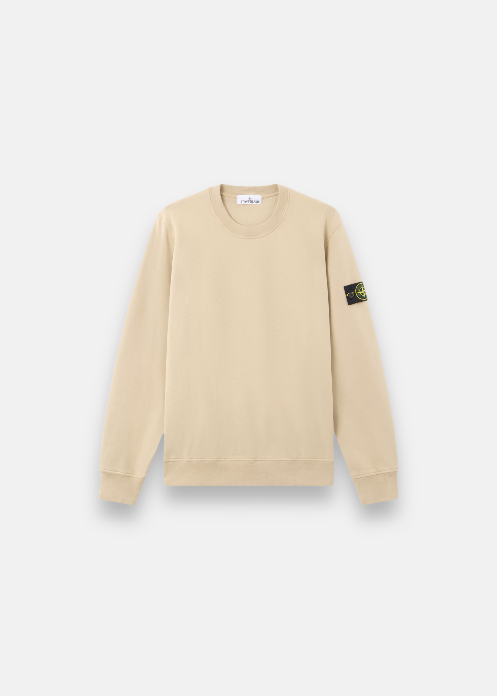 Sweat Stone Island beige à col rond avec patch boussole iconique sur la manche gauche de face