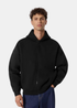 Sweat zippé à capuche Homme Gertrude Titusw oversize noir porté avec un jean brut vue de face