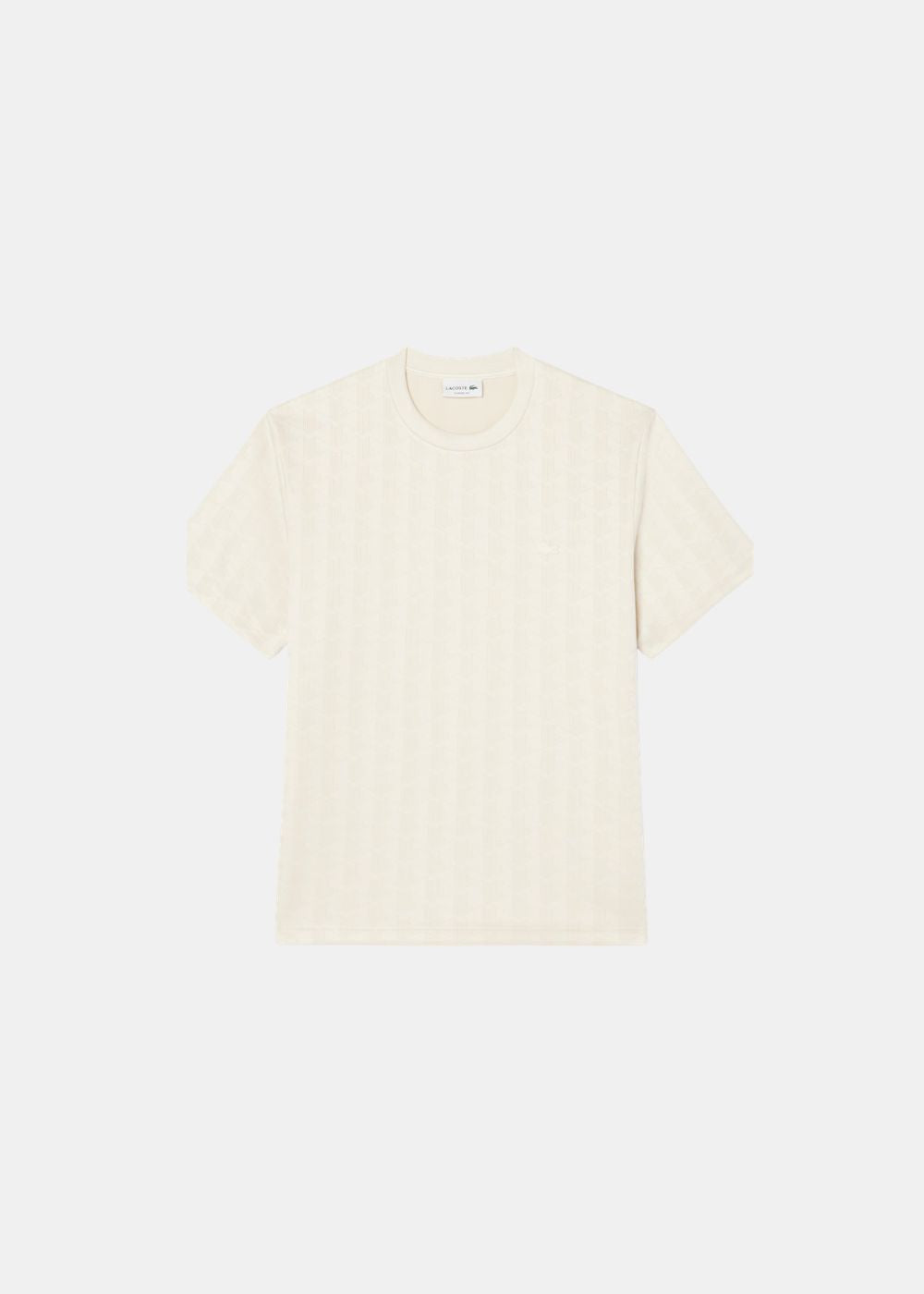 Packshot de face du t-shirt Lacoste crème en maille jacquard avec monogramme ton sur ton.
