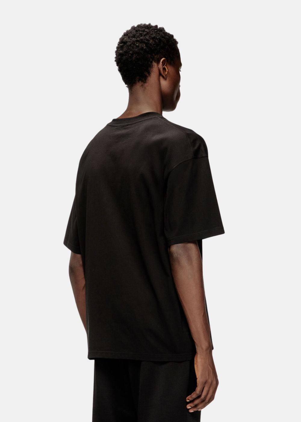 T-shirt noir Diesel en coton à manches courtes porté par un mannequin homme de trois quarts dos
