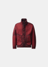 Packshot de la veste réversible bordeaux C.P. Company col montant avec fermeture zippée et détail de surpiqûres