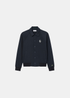 Veste teddy Lacoste marine à manches raglan, boutons-pression et badge rétro, vue de face.
